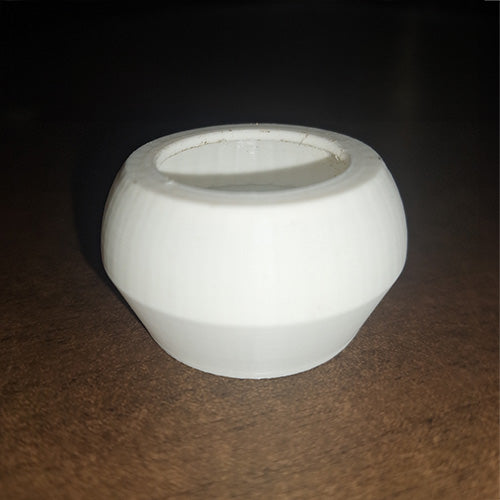 White escape-proof feeding cup for gecko ledge, designed with a smooth inward-sloping rim to prevent insects from crawling out, placed on a dark wood surface.