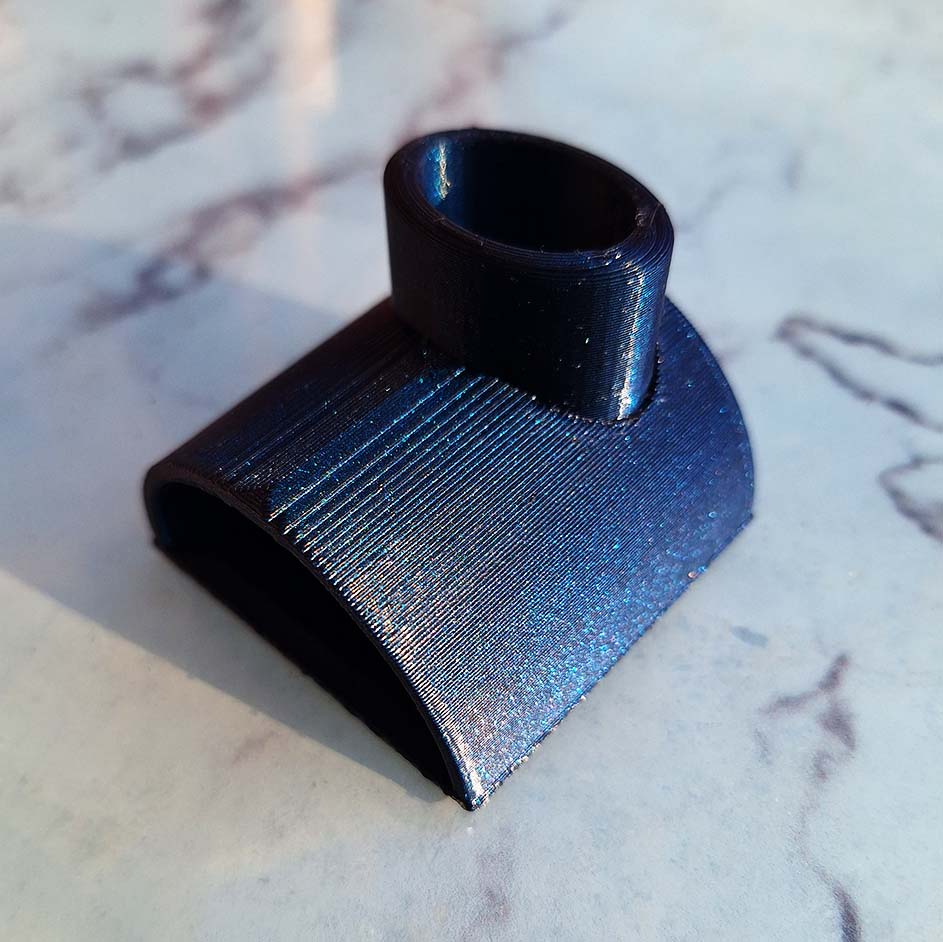 Sparkling Burnt Titanium 'The Cave' aquarium decor, 3D printed with Flashforge PETG, enhancing tank aesthetics with a blue/purple hue.