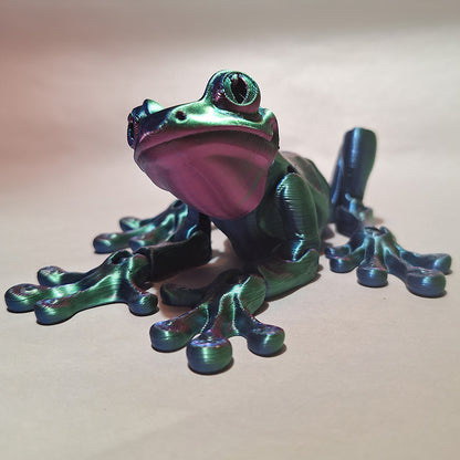 Articulated tri-color silk tree frog in red, blue, and green, ideal for nature enthusiasts and unique home decor collectors.