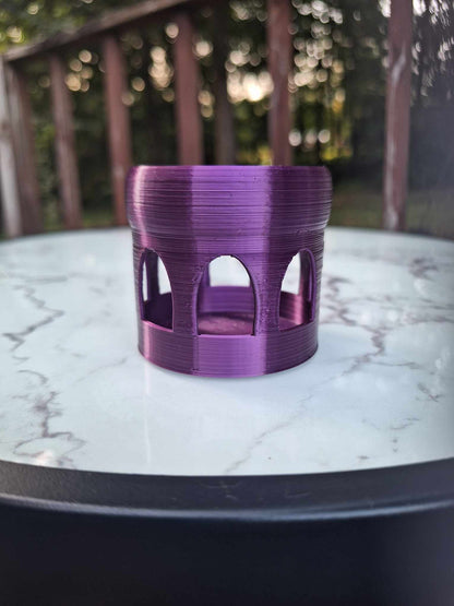 Elegant purple silk Creality PLA 3D-printed Floating Shrimp Gazebo Feeder, designed to enhance feeding time in aquariums, displayed on a marble surface with a blurred natural background.