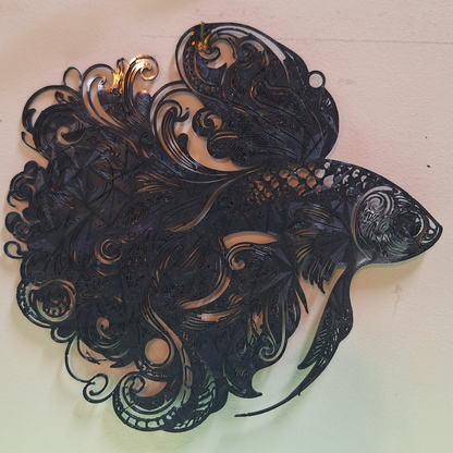 Striking 3D-printed black guppy fish wall art featuring a tribal design, made with Creality Black PLA, presented on a white background.